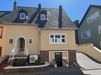Hauptbild Modernisiertes Einfamilienhaus mit Kaminofen, Terrasse und Garten in zentraler Lage von Schweich